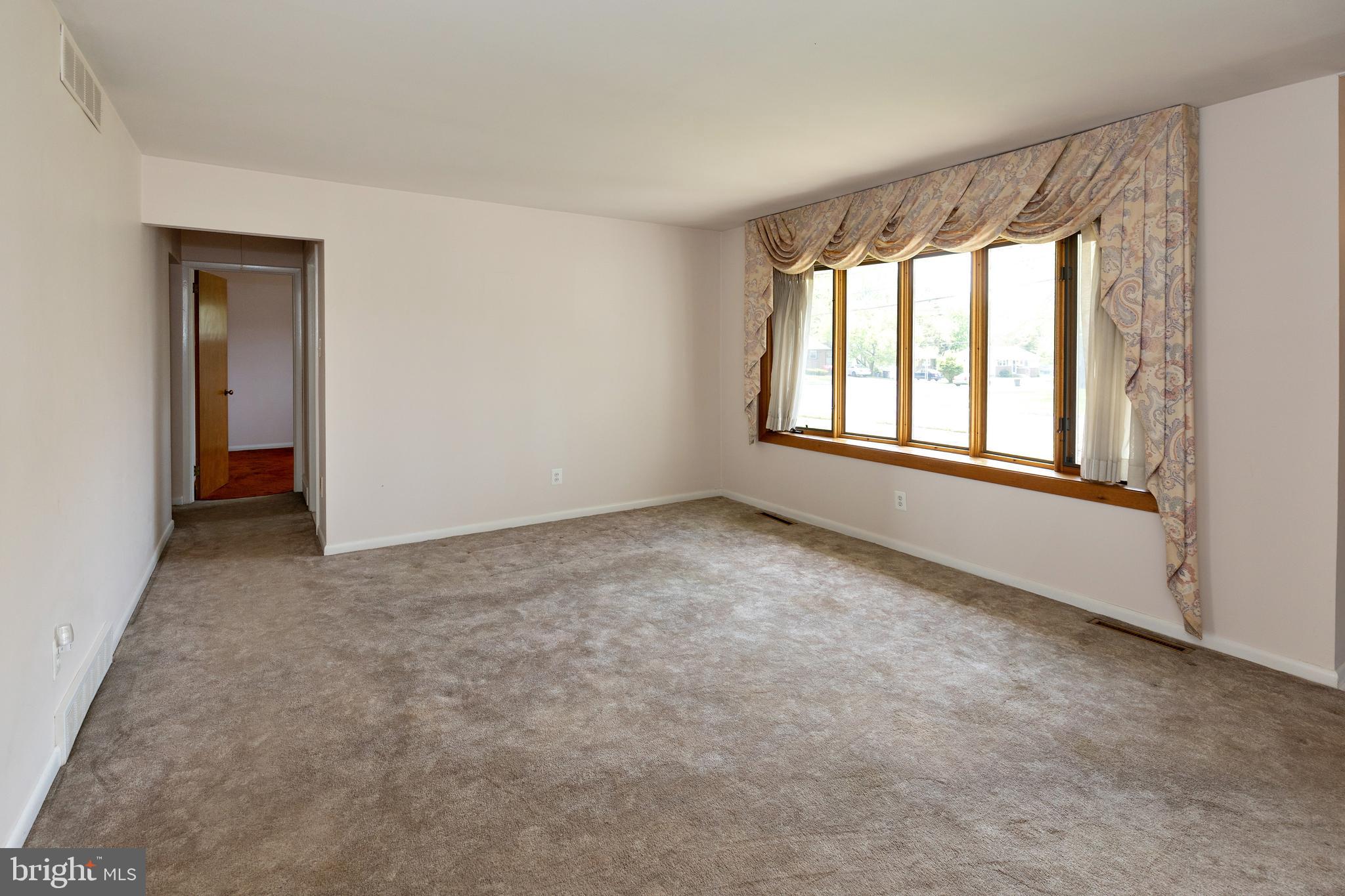 503 Pasadena Drive Magnolia, NJ 08049 - Photo 8 of 43 a view of an empty room with a window
