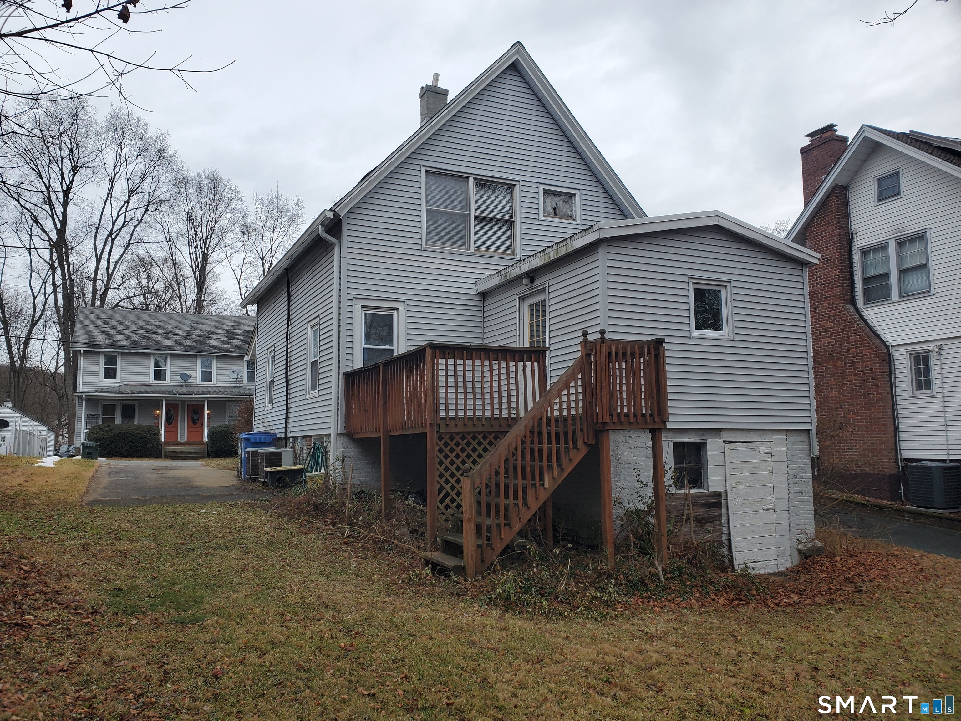 20 Geer Avenue Norwich, CT 06360 - Photo 9 of 10 a view of a house with a yard and lawn chairs