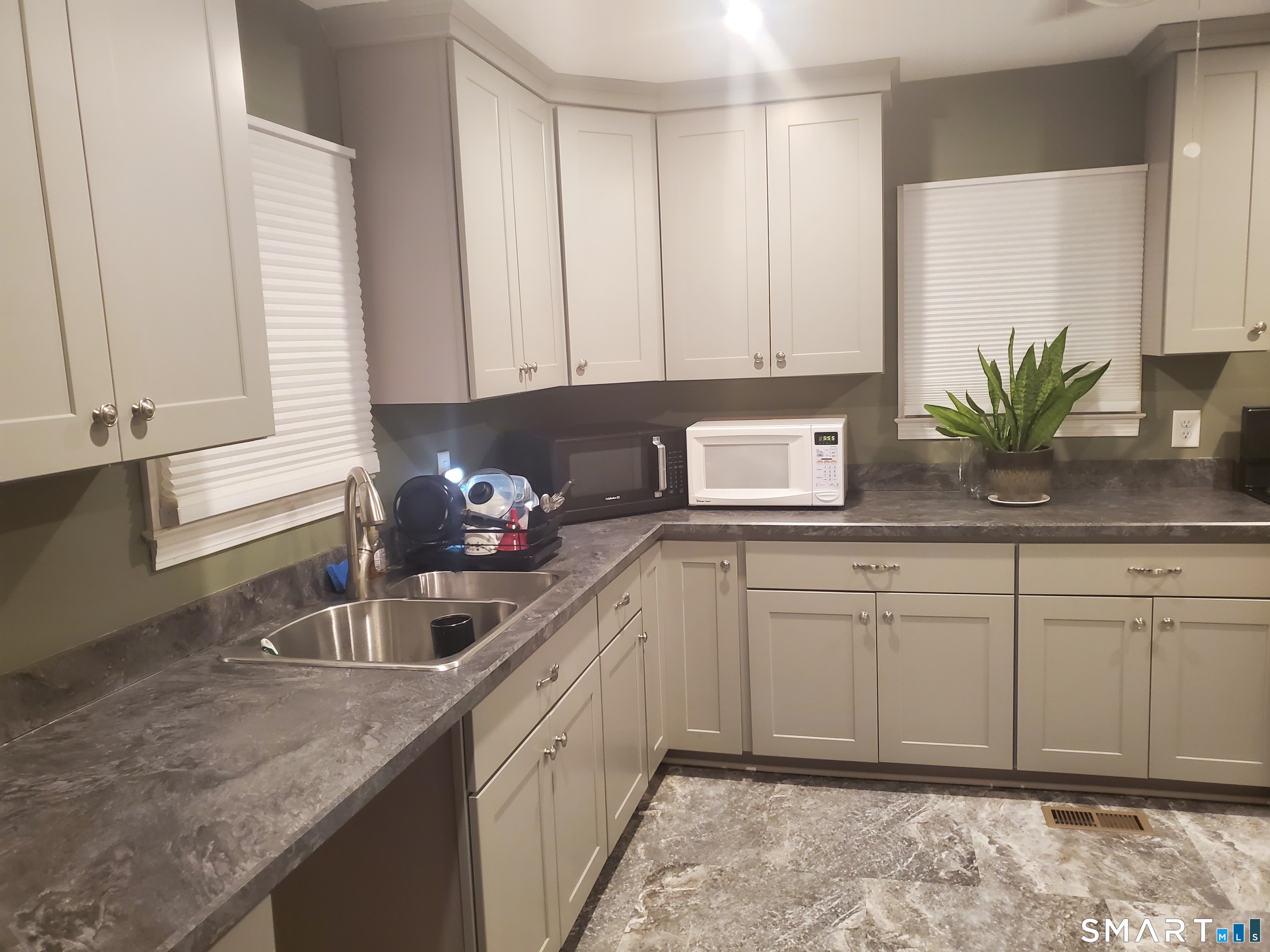 20 Geer Avenue Norwich, CT 06360 - Photo 10 of 10 a kitchen with granite countertop a sink and a white cabinets