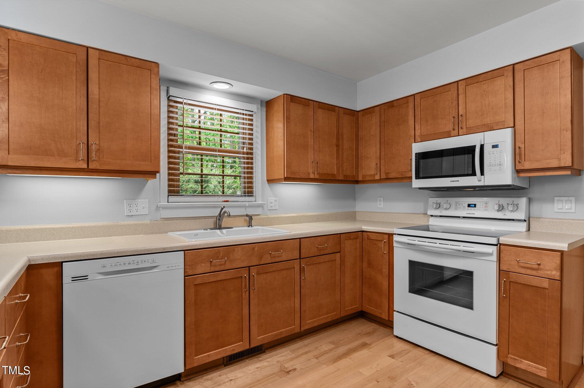 1901 Nipper Road Raleigh, NC 27614 - Photo 13 of 57 a kitchen with sink cabinets and microwave