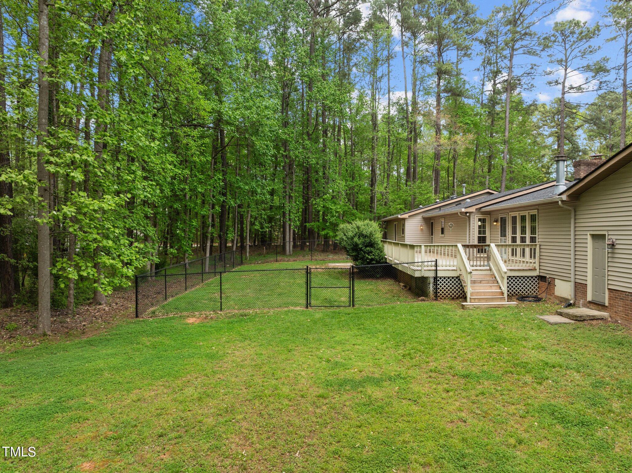 1901 Nipper Road Raleigh, NC 27614 - Photo 3 of 57 a view of a house with backyard and sitting area