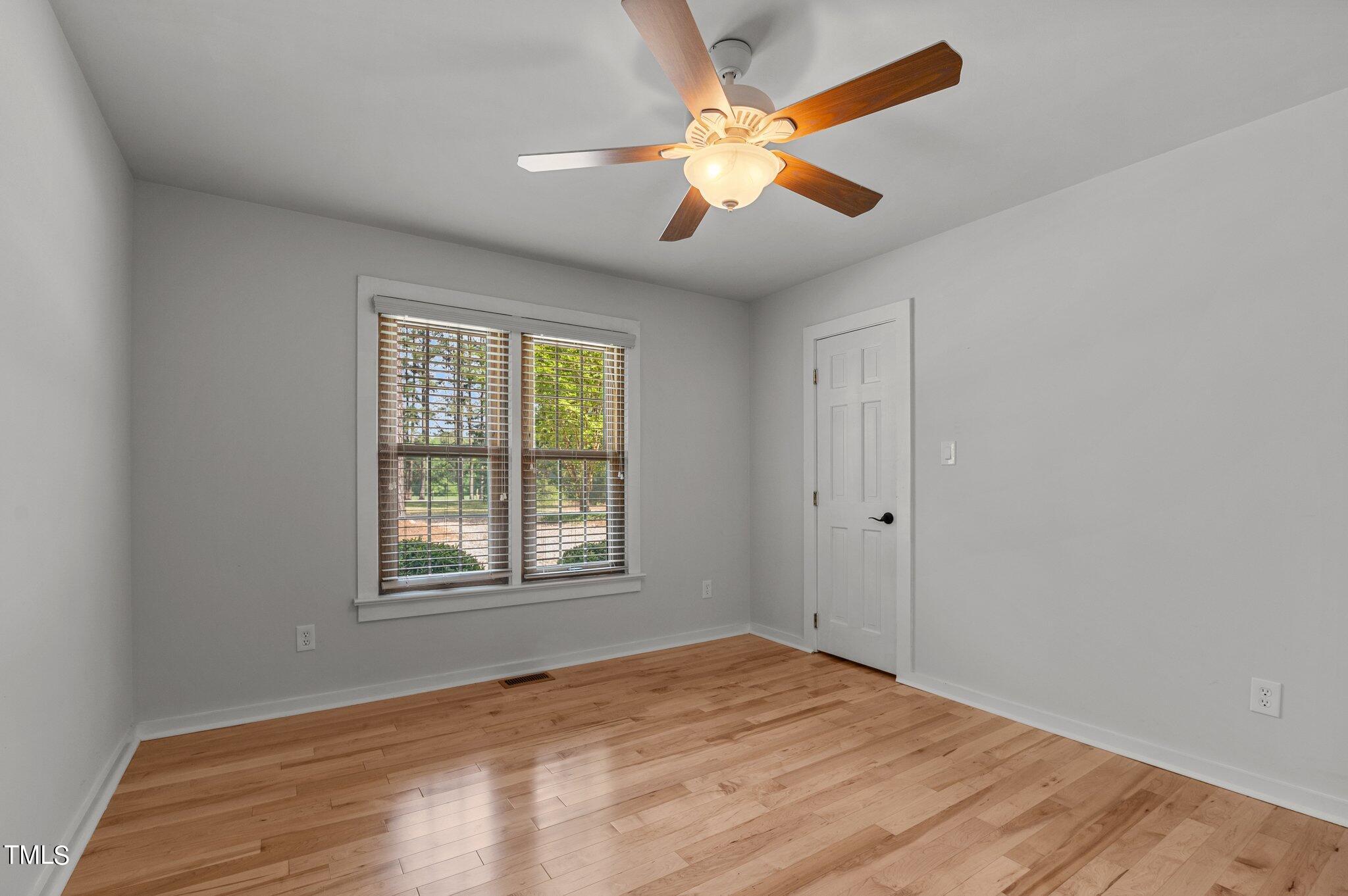 1901 Nipper Road Raleigh, NC 27614 - Photo 32 of 57 a view of an empty room with a window