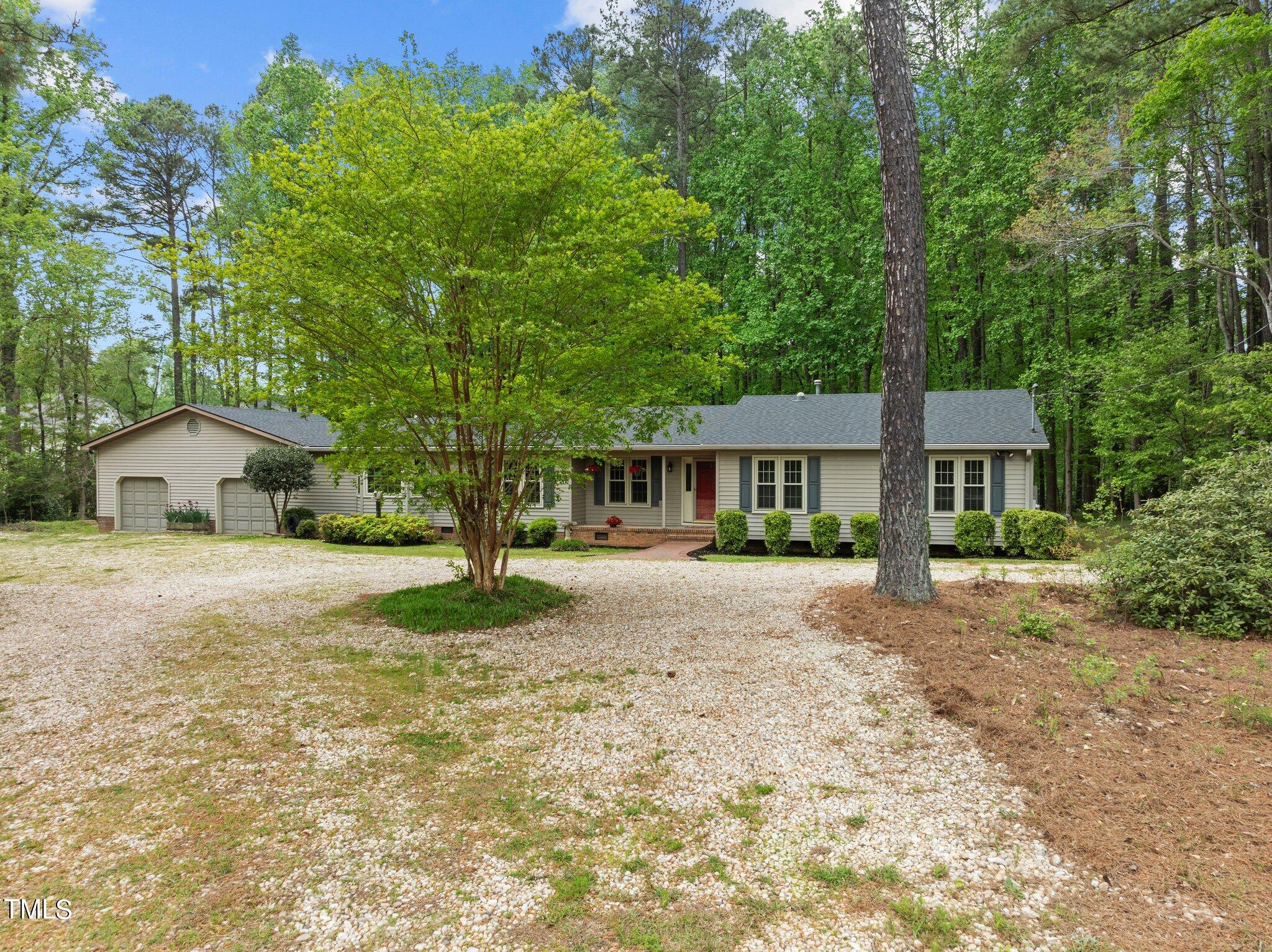 1901 Nipper Road Raleigh, NC 27614 - Photo 54 of 57 a front view of a house with a garden