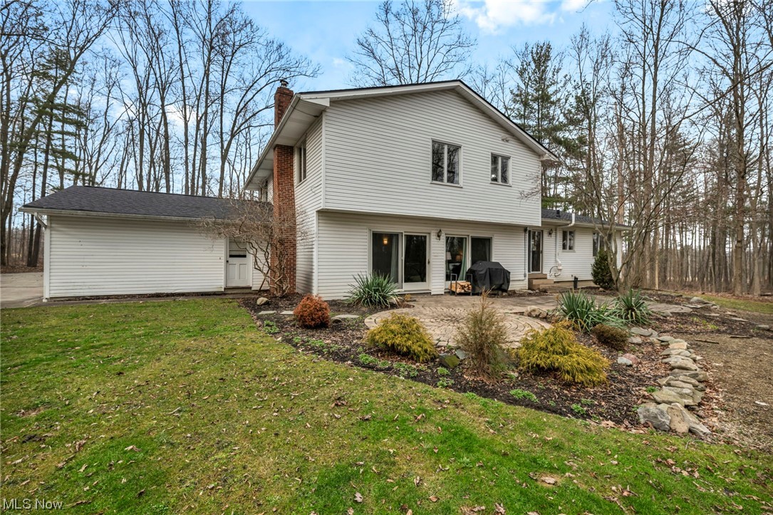 3324 Poe Road Medina, OH 44256 - Photo 23 of 26 Back of house with a lawn and a patio area