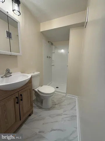 a view of two chairs in the patio