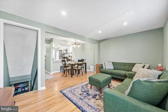 a living room with furniture and a rug