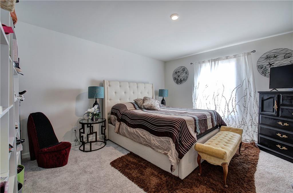 635 Tudor Street Euharlee, GA 30145 - Photo 22 of 39 a bedroom with a bed and a couch