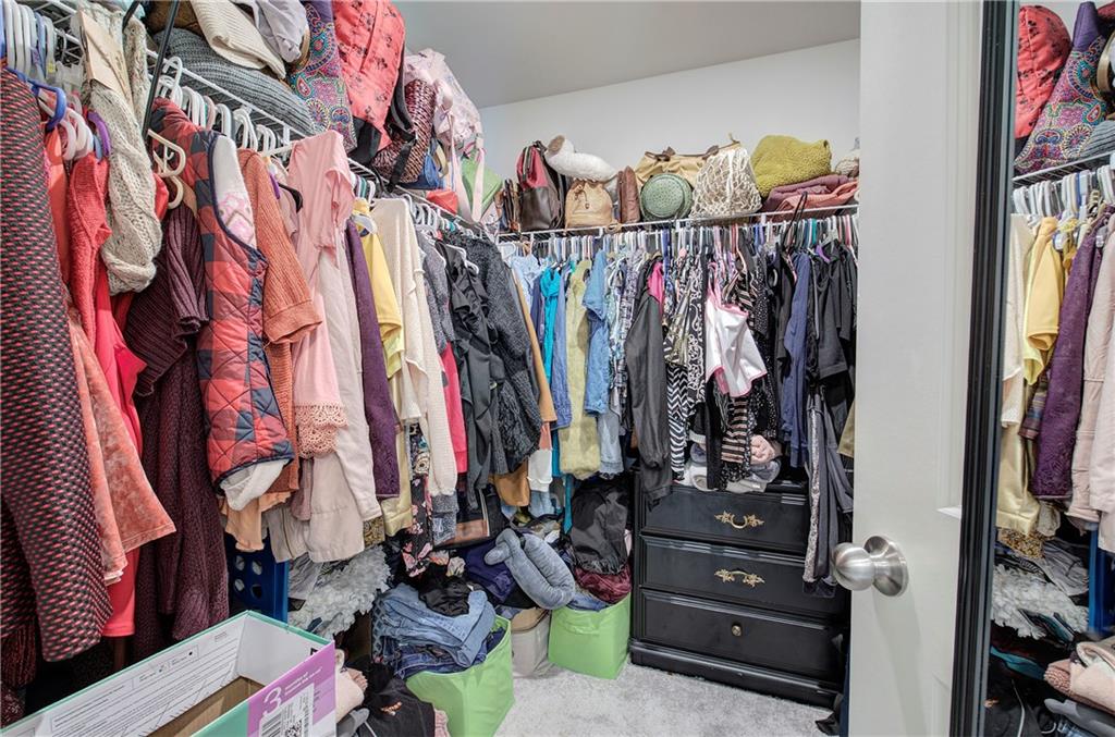 635 Tudor Street Euharlee, GA 30145 - Photo 26 of 39 a view of walk in closet with clothes