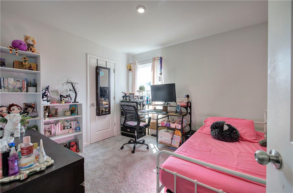635 Tudor Street Euharlee, GA 30145 - Photo 29 of 39 a bedroom with a bed and a computer on a desk