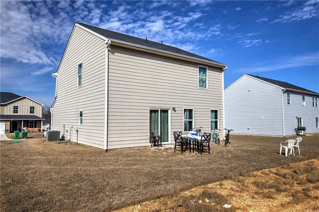 635 Tudor Street Euharlee, GA 30145 - Photo 35 of 39 a view of a house with a patio
