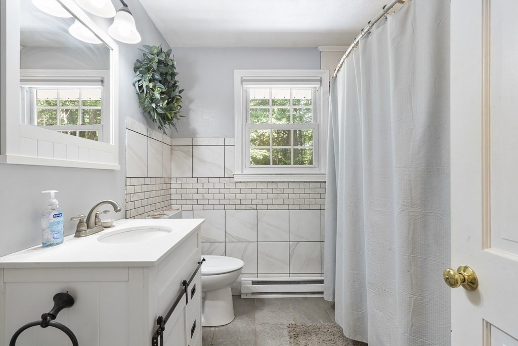 8 Juniper Lane Rutland, MA 01543 - Photo 16 of 36 a bathroom with a sink toilet and window