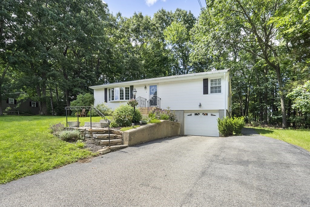 8 Juniper Lane Rutland, MA 01543 - Photo 3 of 36 a front view of a house with garden