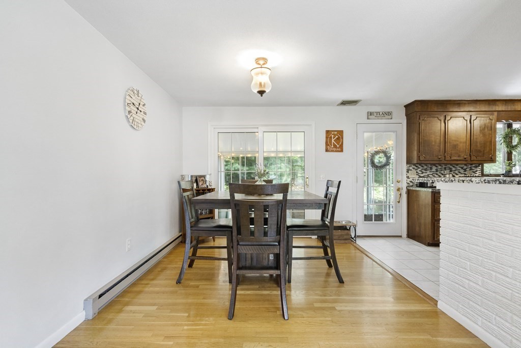 8 Juniper Lane Rutland, MA 01543 - Photo 8 of 36 a view of a dining room with furniture and wooden floor