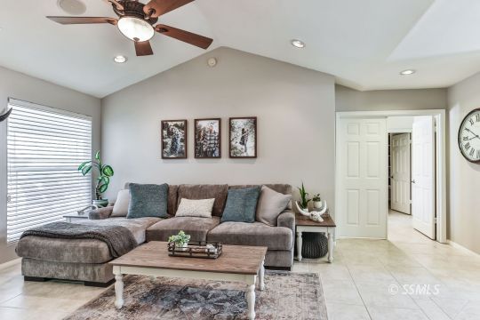 1214 North Guam Street Ridgecrest, CA 93555 - Photo 7 of 48 a living room with furniture and a ceiling fan