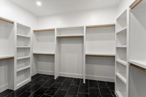 a view of an empty walk in closet