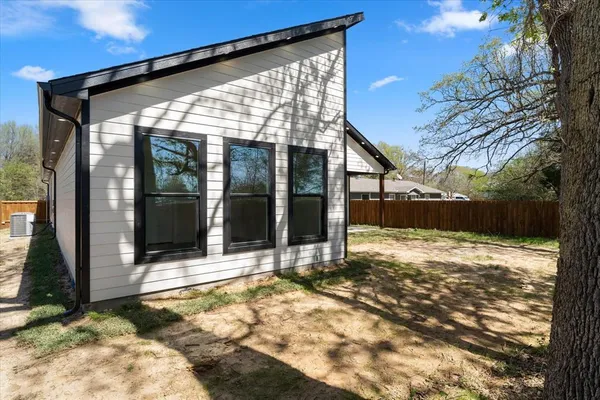 a view of a yard with swimming pool and trees