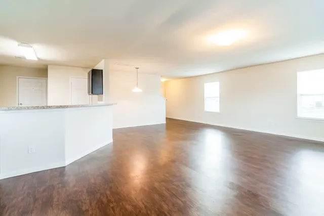 a view of a livingroom with wooden floor