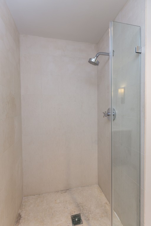 303 Third Street, Unit 417 Cambridge, MA 02142 - Photo 11 of 22 a bathroom with a shower