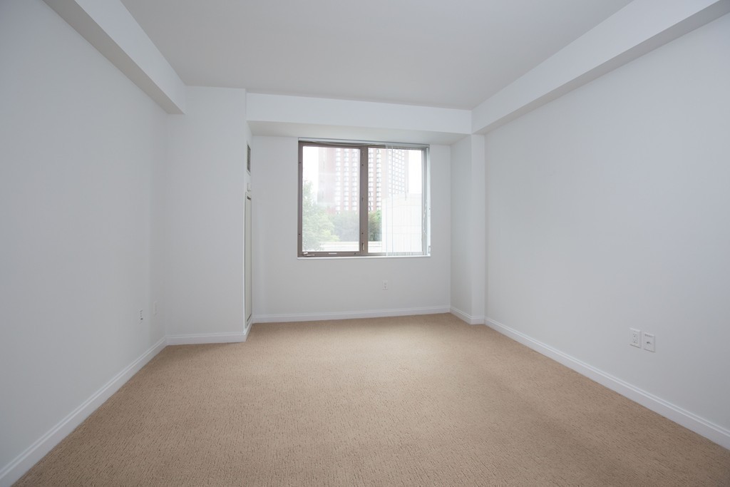303 Third Street, Unit 417 Cambridge, MA 02142 - Photo 12 of 22 an empty room with a window