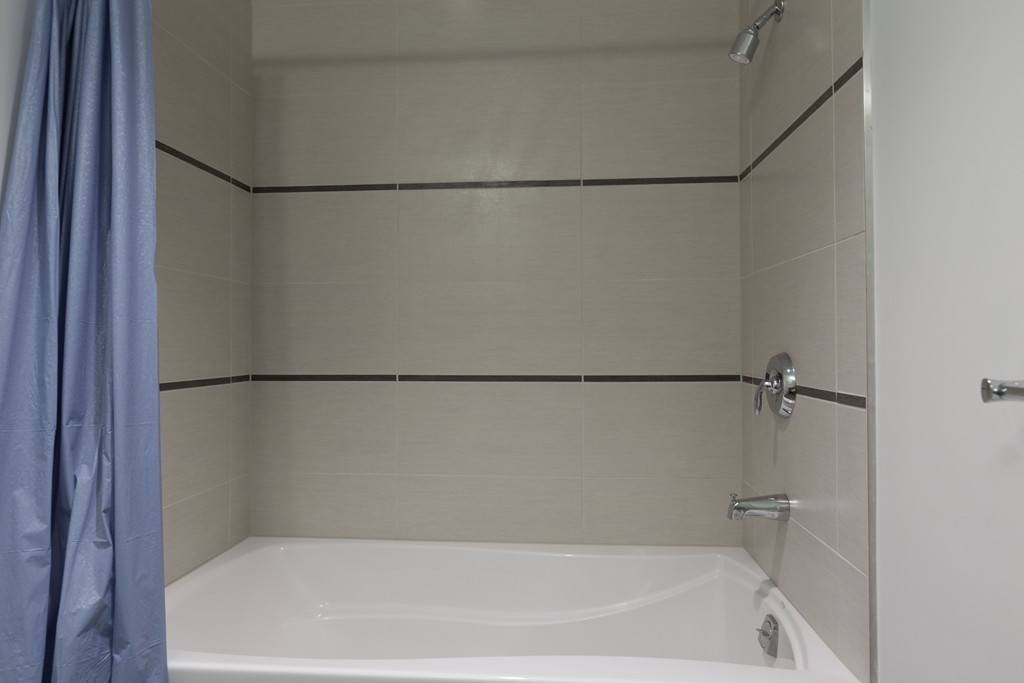 303 Third Street, Unit 417 Cambridge, MA 02142 - Photo 14 of 22 a bathroom with a bath tub and a shower
