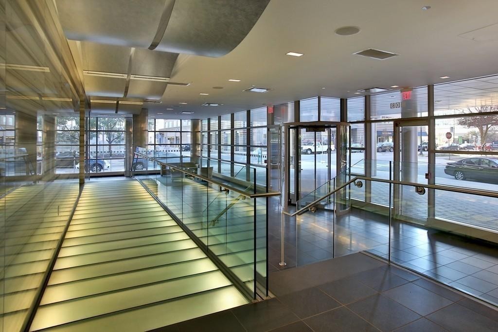 303 Third Street, Unit 417 Cambridge, MA 02142 - Photo 15 of 22 a bathroom with lots of counter and glass windows