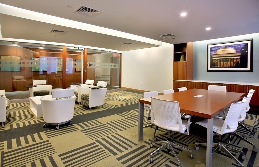 303 Third Street, Unit 417 Cambridge, MA 02142 - Photo 16 of 22 a living room with a couch and a table