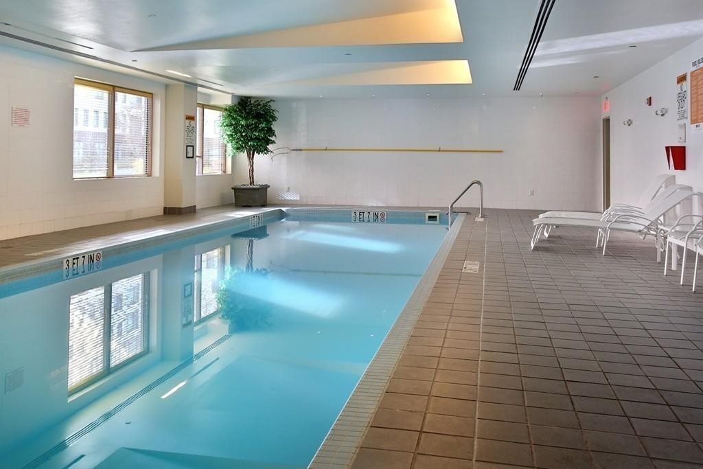 303 Third Street, Unit 417 Cambridge, MA 02142 - Photo 20 of 22 a hallway with a large window