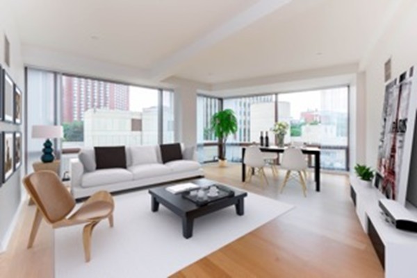 303 Third Street, Unit 417 Cambridge, MA 02142 - Photo 2 of 22 a living room with furniture and a fireplace