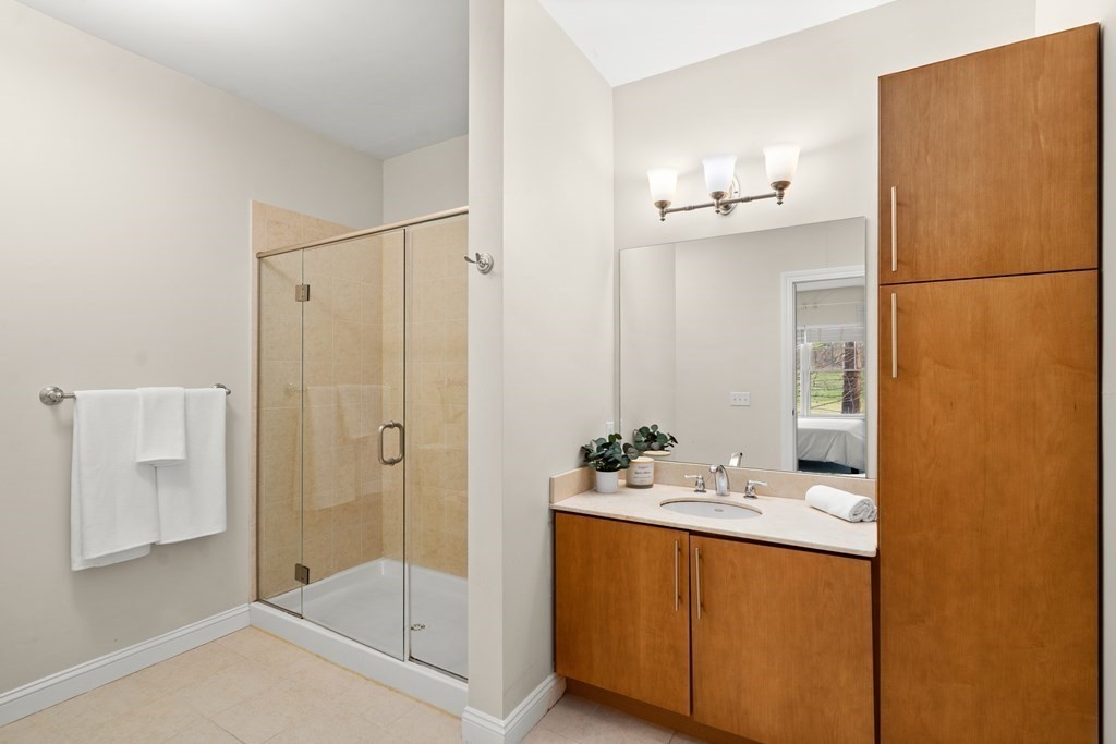 35 Commonwealth Avenue, Unit 103 Newton, MA 02467 - Photo 11 of 23 a bathroom with a shower and a sink