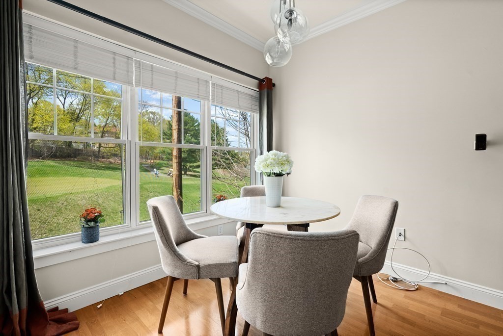 35 Commonwealth Avenue, Unit 103 Newton, MA 02467 - Photo 8 of 23 a view of a dining room with furniture window and outside view