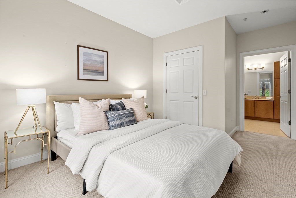 35 Commonwealth Avenue, Unit 103 Newton, MA 02467 - Photo 9 of 23 a bedroom with bed and night stand