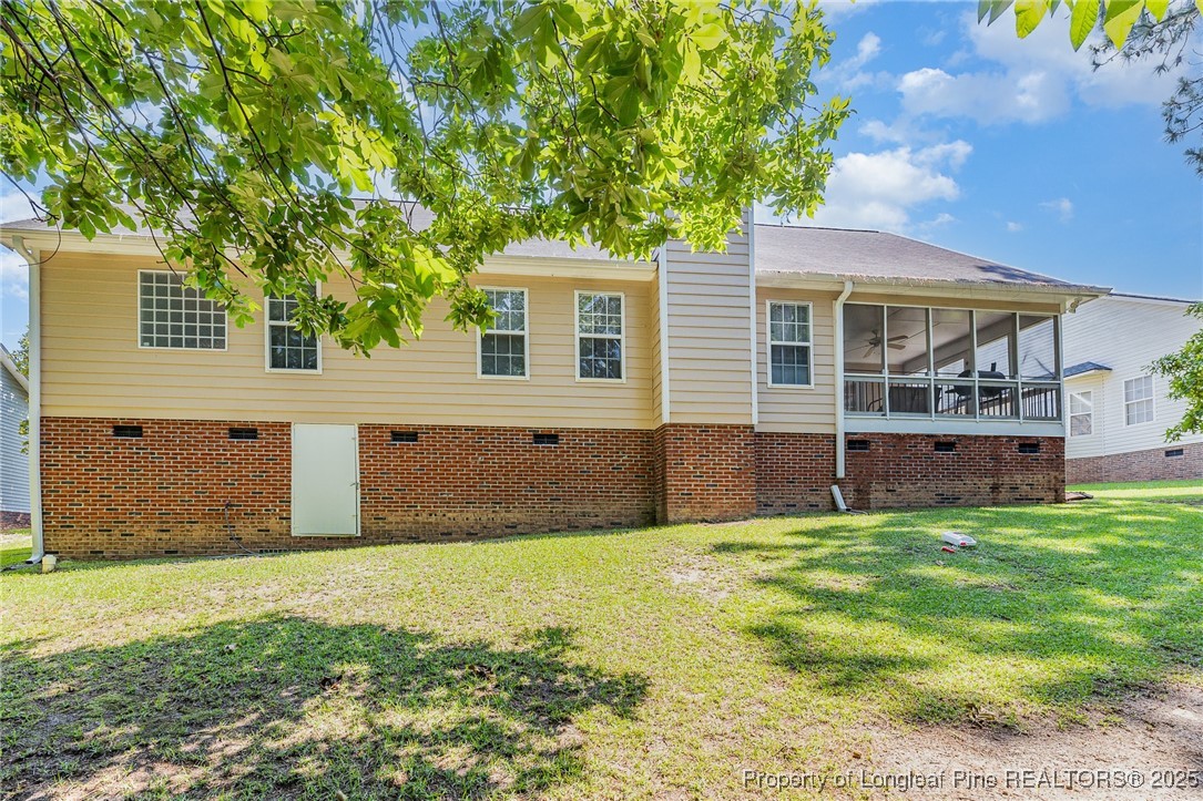 615 Bramblegate Road Hope Mills, NC 28348 - Photo 24 of 26 a front view of house with yard and trees in the background