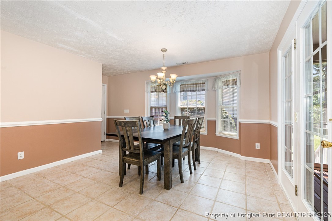 615 Bramblegate Road Hope Mills, NC 28348 - Photo 9 of 26 a view of a dining room with furniture and window