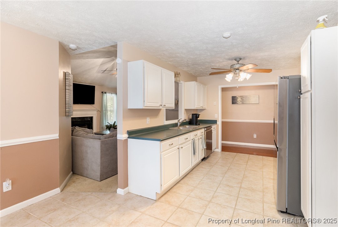 615 Bramblegate Road Hope Mills, NC 28348 - Photo 10 of 26 a large kitchen with a stove a refrigerator and a sink