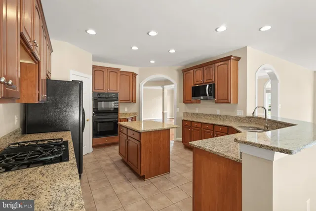 a view of kitchen with furniture and wooden floor