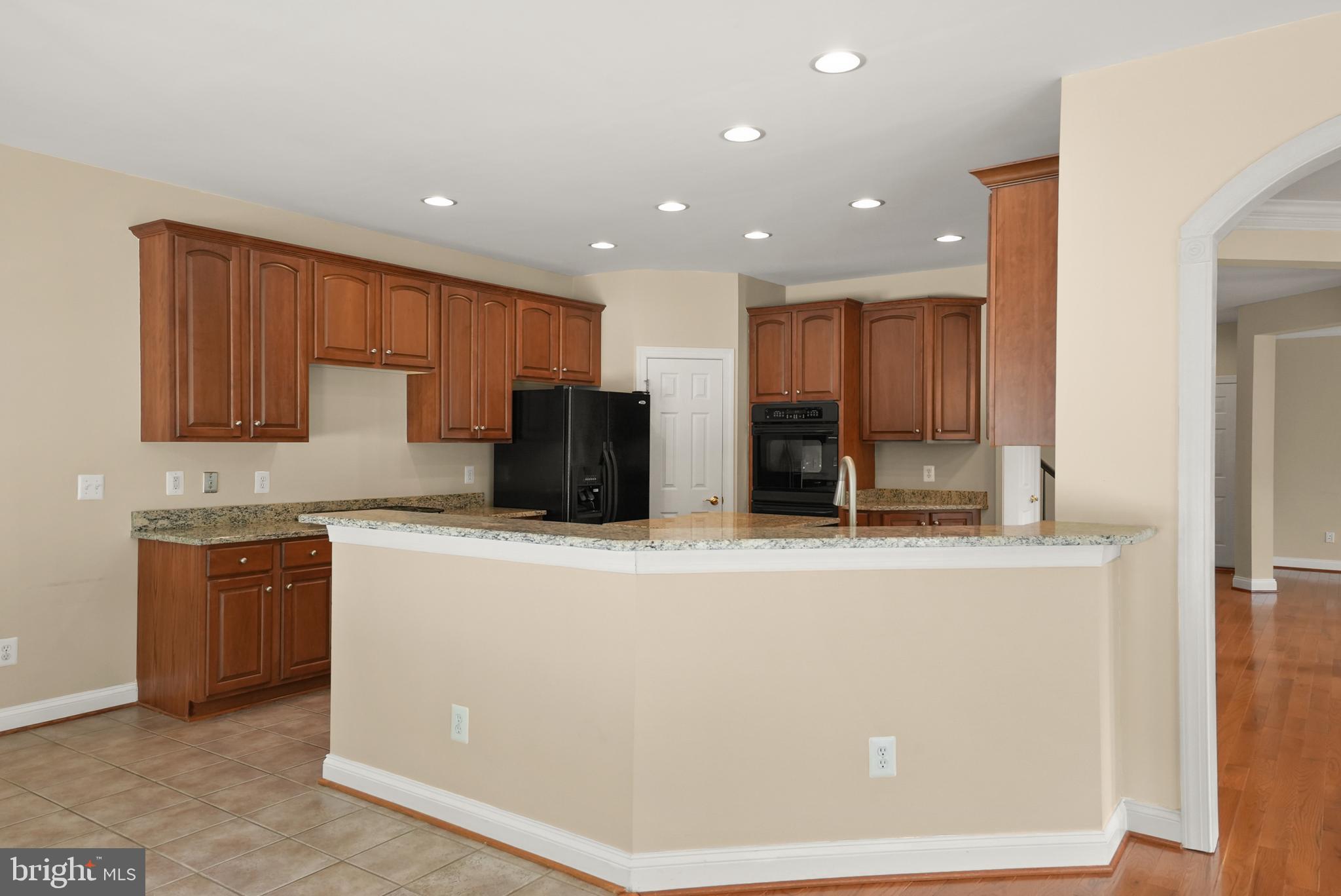43616 Carradoc Farm Terrace Leesburg, VA 20176 - Photo 18 of 63 a kitchen with stainless steel appliances a refrigerator sink and microwave