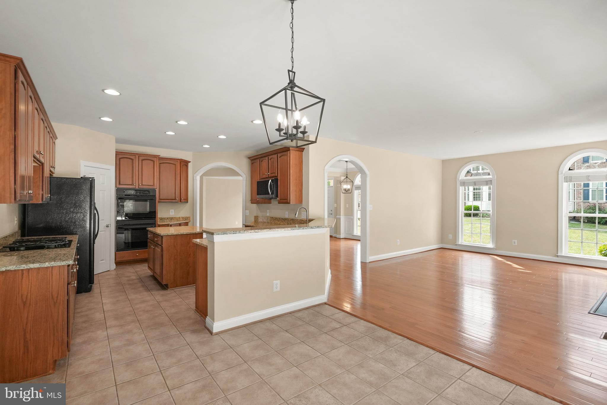 43616 Carradoc Farm Terrace Leesburg, VA 20176 - Photo 20 of 63 a view of kitchen with furniture and wooden floor