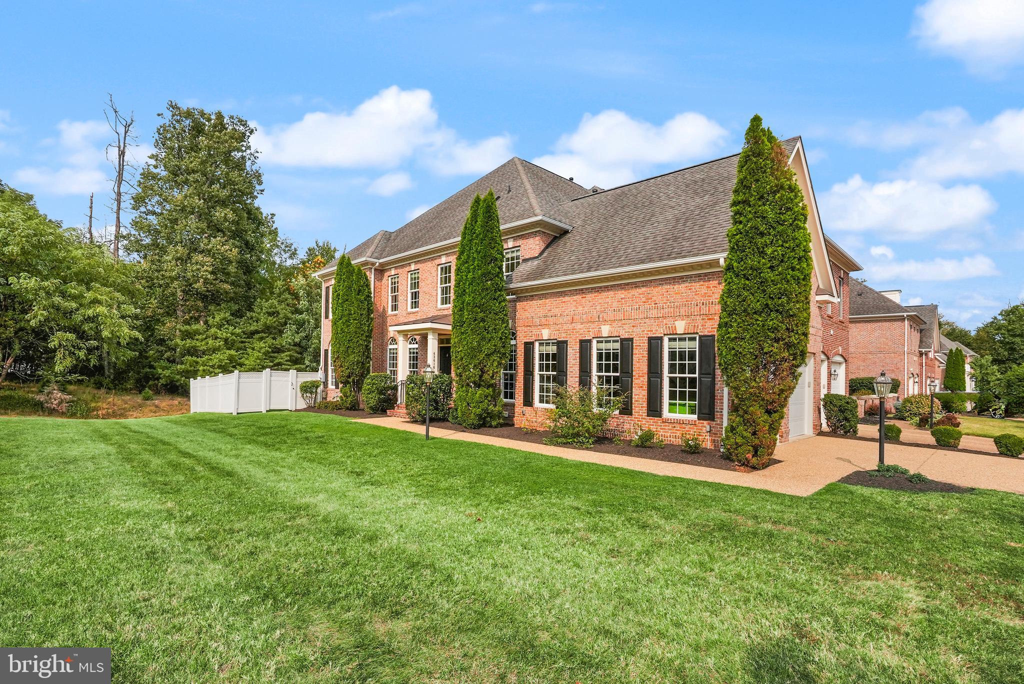 43616 Carradoc Farm Terrace Leesburg, VA 20176 - Photo 2 of 63 a view of a house with big yard and large trees