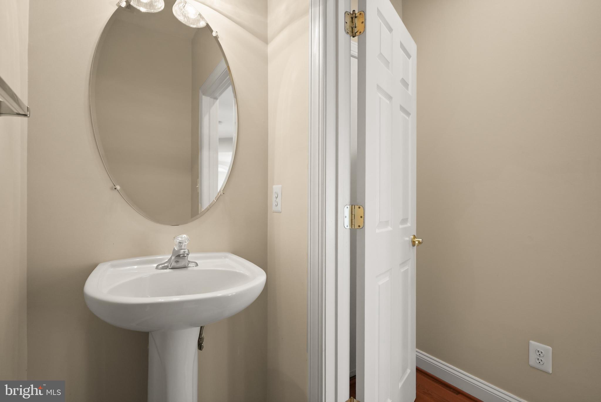 43616 Carradoc Farm Terrace Leesburg, VA 20176 - Photo 21 of 63 a bathroom with a sink and a mirror