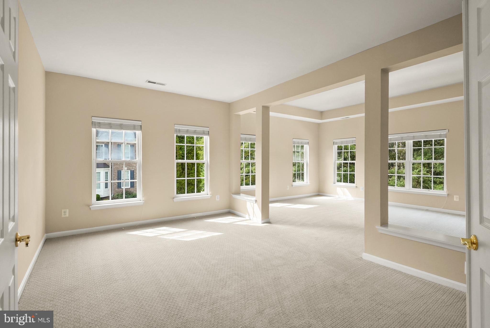 43616 Carradoc Farm Terrace Leesburg, VA 20176 - Photo 28 of 63 a view of a big room with windows and chandelier fan