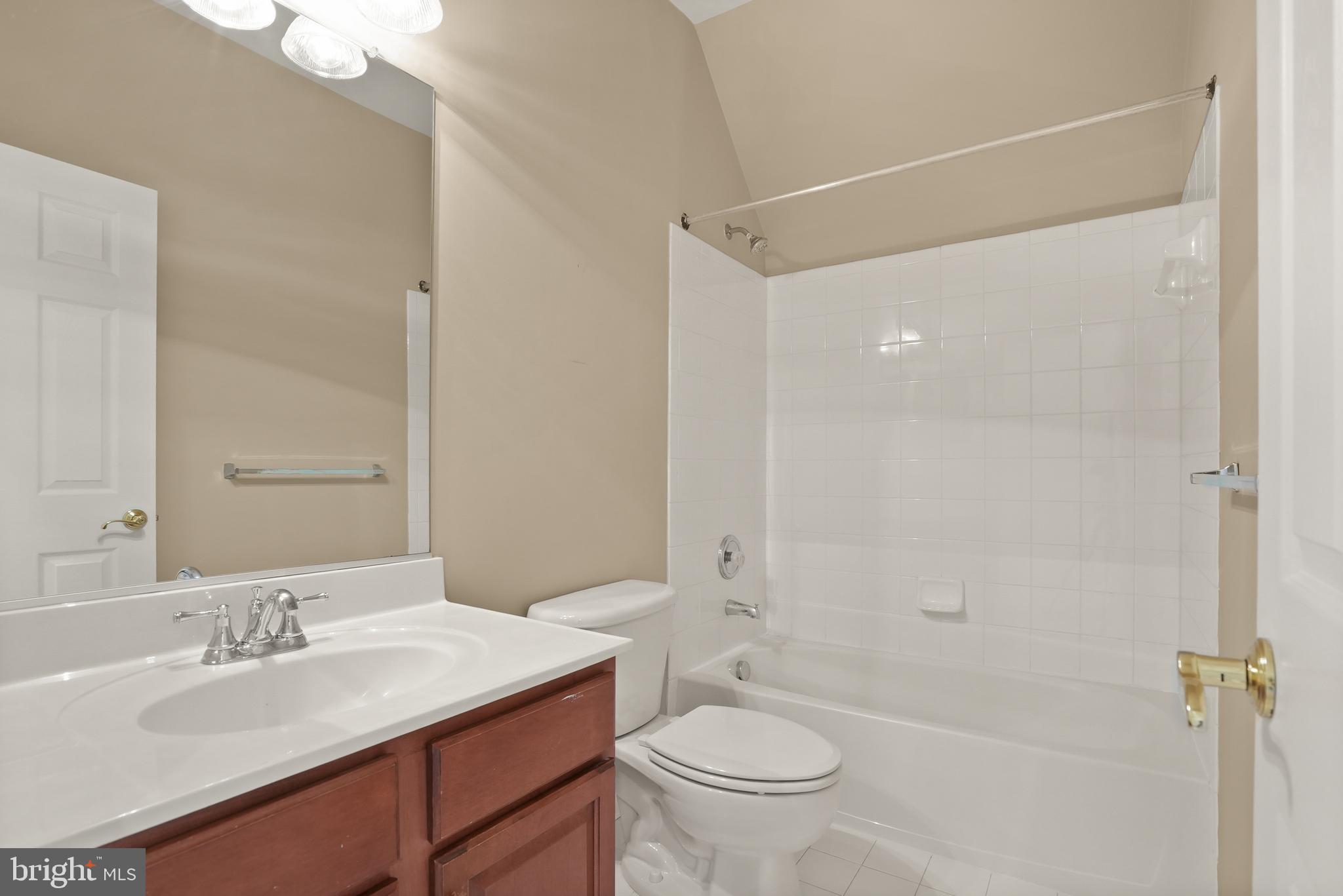 43616 Carradoc Farm Terrace Leesburg, VA 20176 - Photo 42 of 63 a bathroom with a granite countertop sink toilet and shower