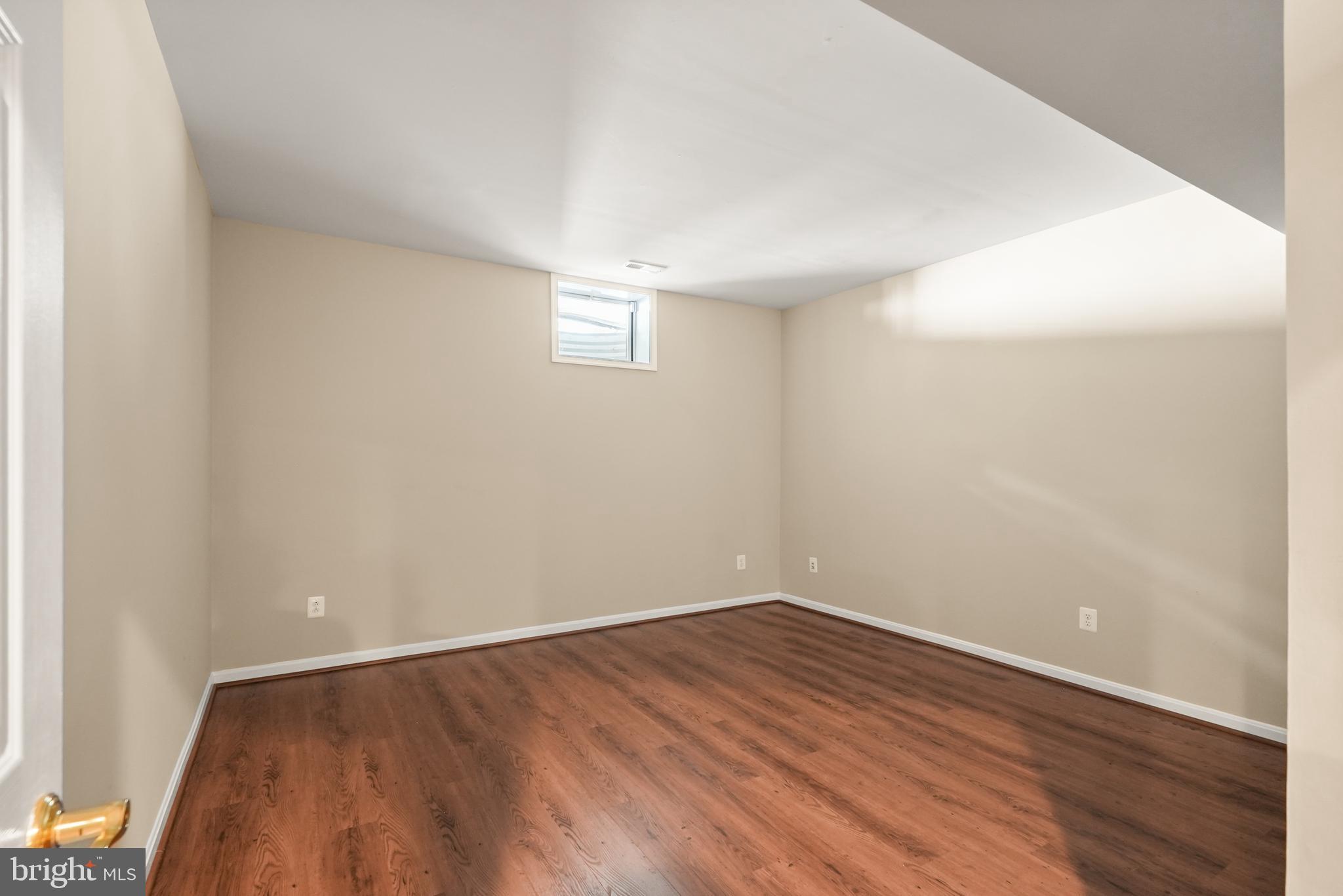 43616 Carradoc Farm Terrace Leesburg, VA 20176 - Photo 48 of 63 a view of an empty room with wooden floor