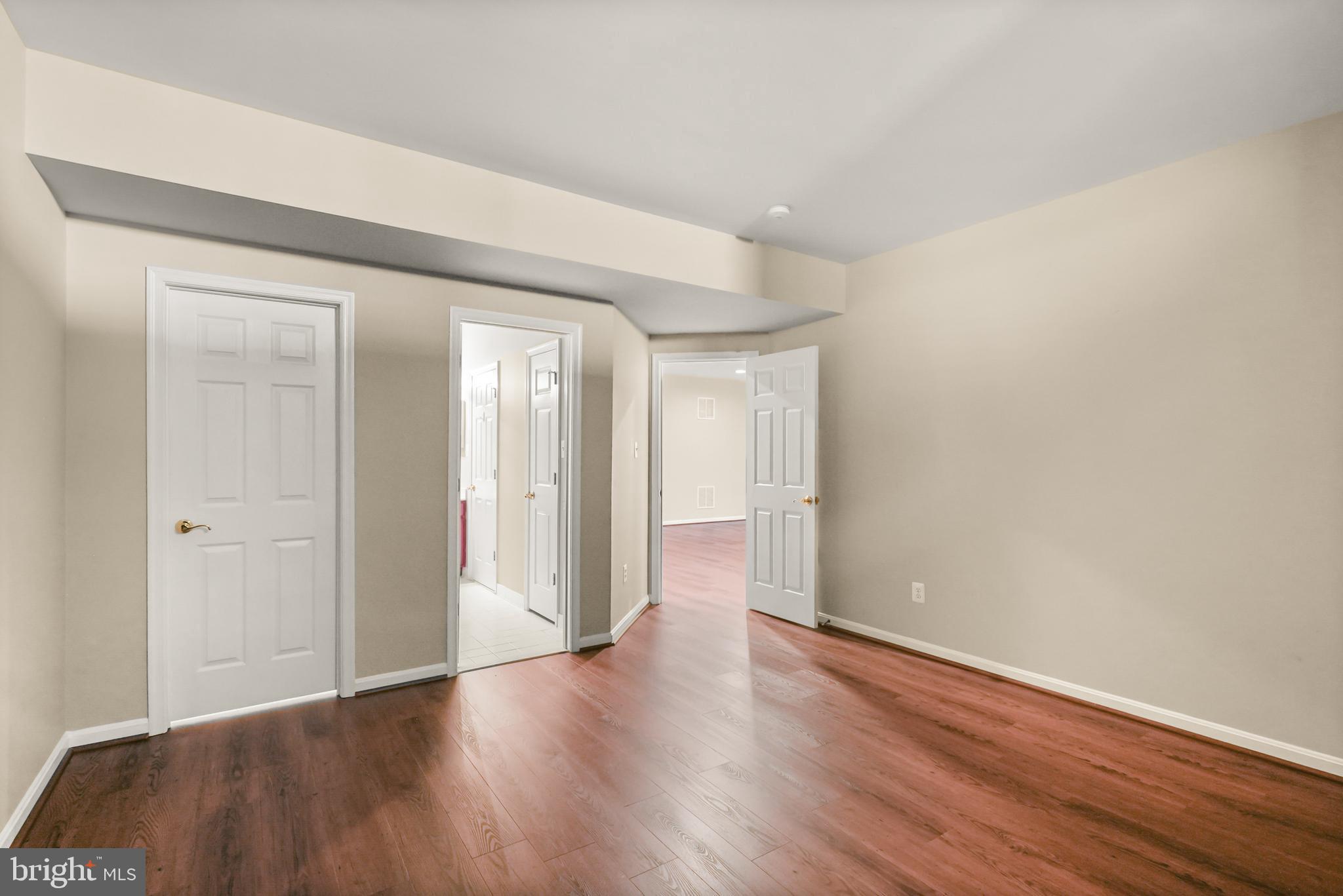 43616 Carradoc Farm Terrace Leesburg, VA 20176 - Photo 49 of 63 a view of an empty room and wooden floor