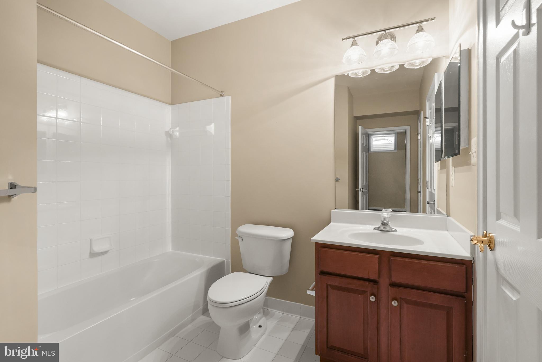 43616 Carradoc Farm Terrace Leesburg, VA 20176 - Photo 50 of 63 a bathroom with a sink a toilet and shower