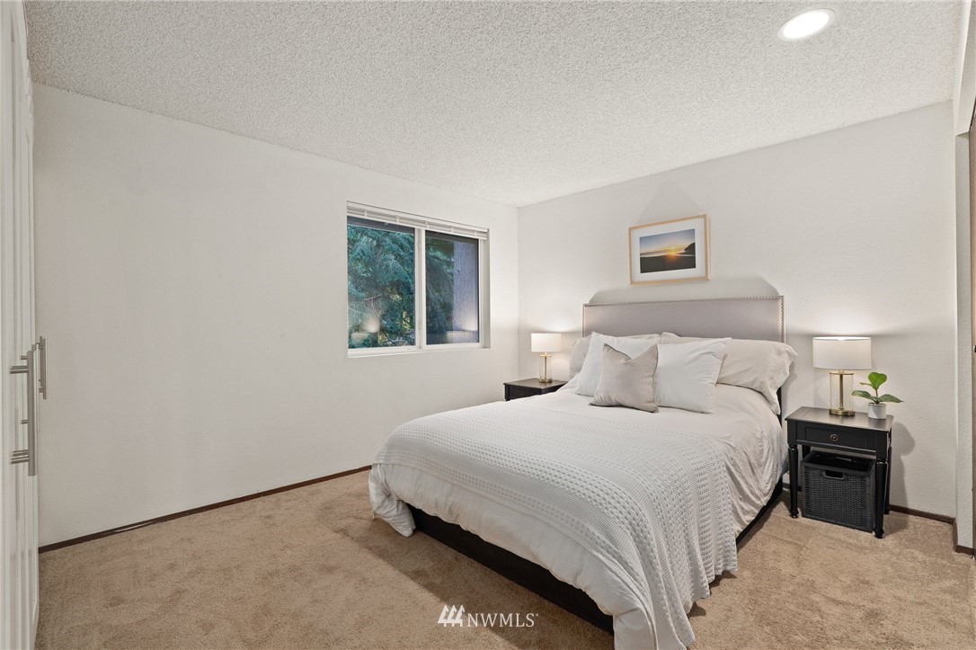 3305 199th Place Southeast Bothell, WA 98012 - Photo 15 of 39 a bedroom with a bed and a night stand