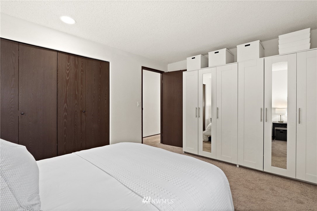 3305 199th Place Southeast Bothell, WA 98012 - Photo 16 of 39 a bedroom with a bed and a cabinet