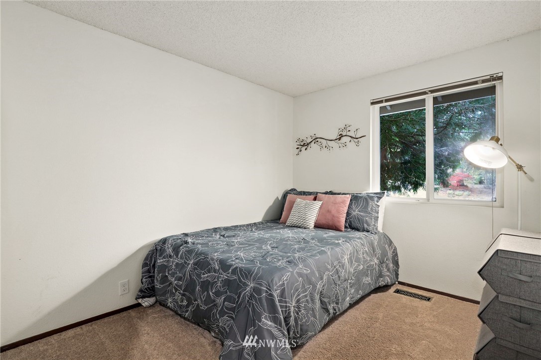 3305 199th Place Southeast Bothell, WA 98012 - Photo 17 of 39 a bedroom with a bed and a window