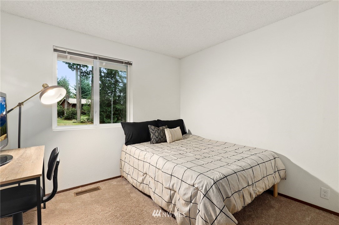 3305 199th Place Southeast Bothell, WA 98012 - Photo 18 of 39 a bedroom with a bed and a window
