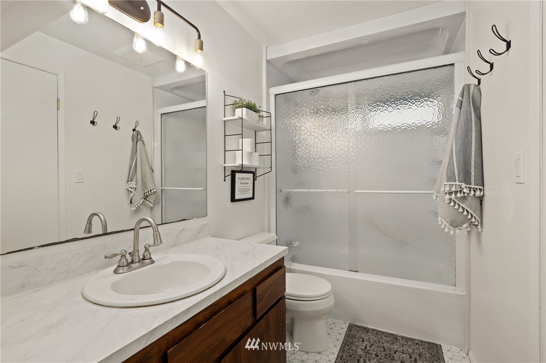 3305 199th Place Southeast Bothell, WA 98012 - Photo 19 of 39 a bathroom with a sink toilet and shower