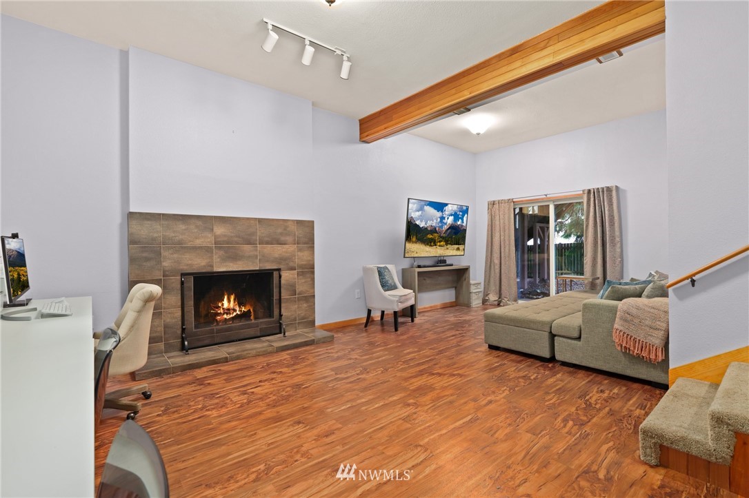 3305 199th Place Southeast Bothell, WA 98012 - Photo 20 of 39 a living room with furniture and a fireplace